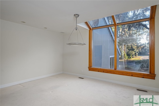 unfurnished room with carpet floors