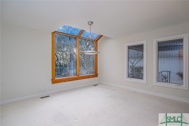 unfurnished dining area with carpet