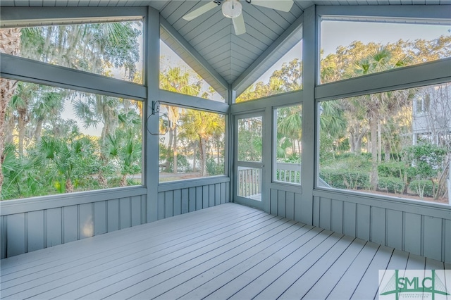 unfurnished sunroom featuring ceiling fan and vaulted ceiling