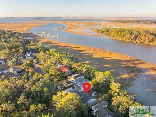 aerial view at dusk with a water view