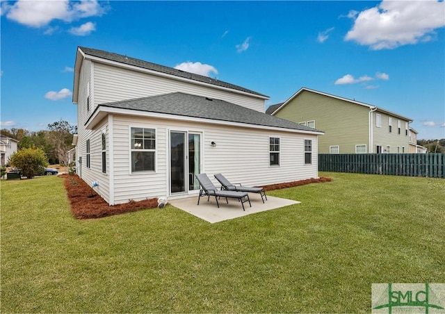 back of property featuring a patio and a lawn