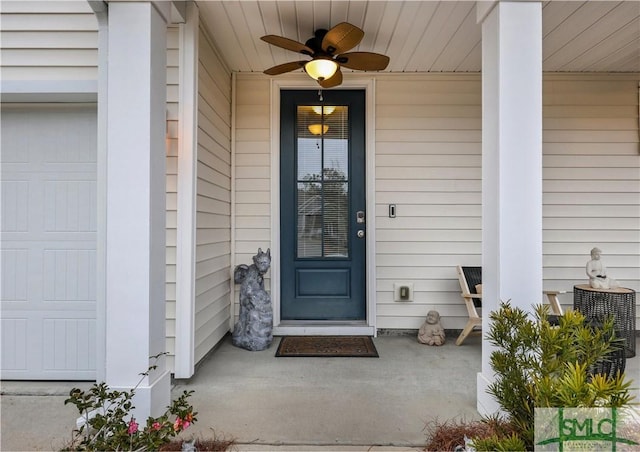 entrance to property featuring covered porch and ceiling fan