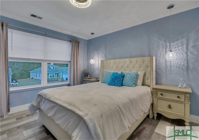 bedroom with hardwood / wood-style floors