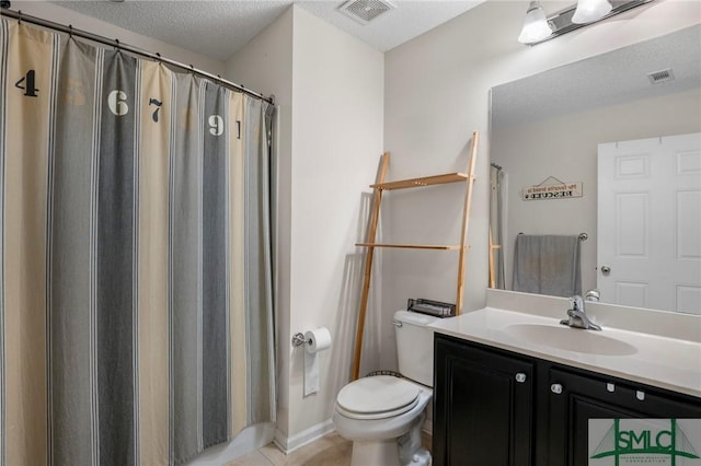 bathroom with toilet, a textured ceiling, walk in shower, tile patterned flooring, and vanity