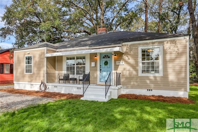 single story home with a front yard and a porch