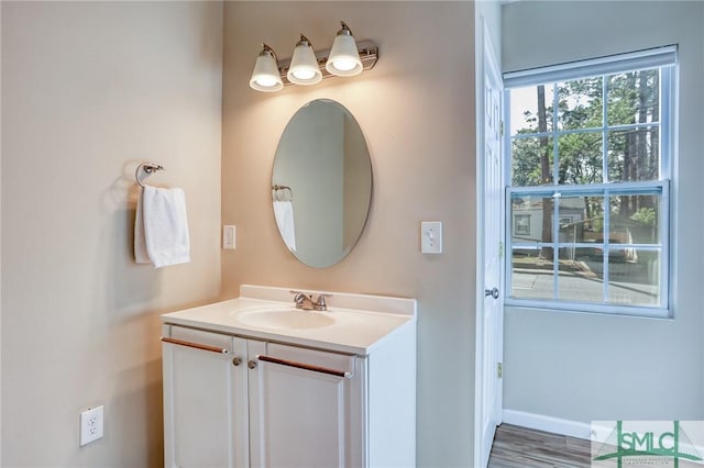 bathroom featuring hardwood / wood-style floors and vanity