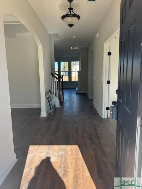 hall with dark hardwood / wood-style flooring