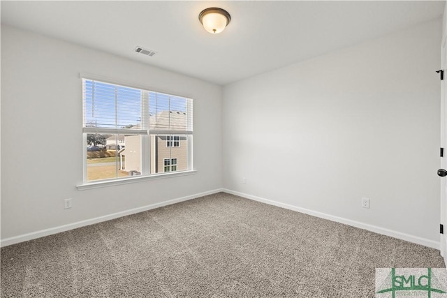 unfurnished room featuring visible vents, baseboards, and carpet flooring