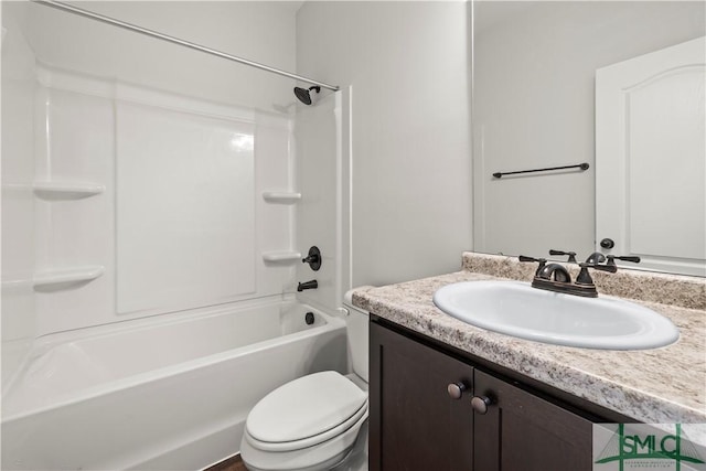 bathroom with shower / tub combination, toilet, and vanity