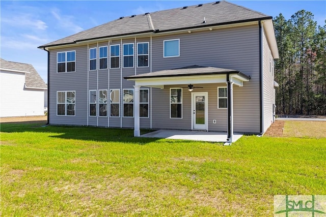 rear view of house featuring a patio area, a lawn, and ceiling fan