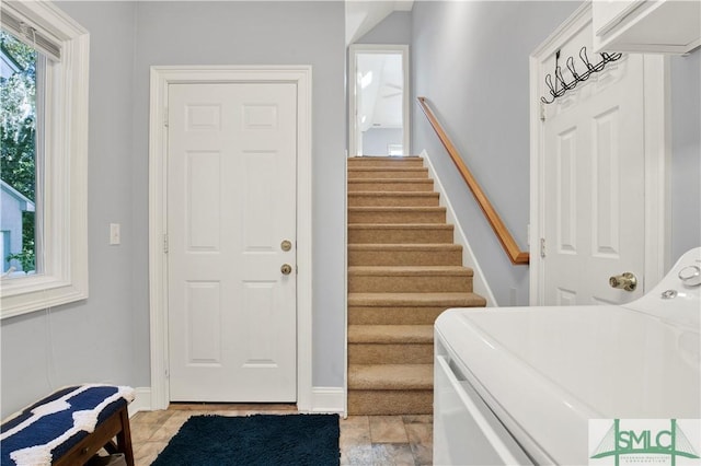 laundry area with independent washer and dryer