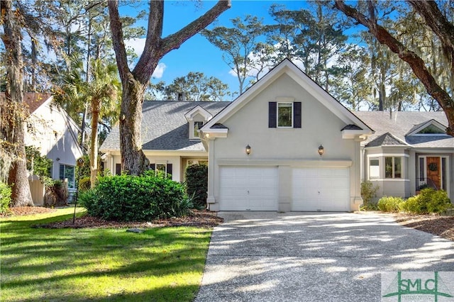 view of front of house featuring a front yard and a garage