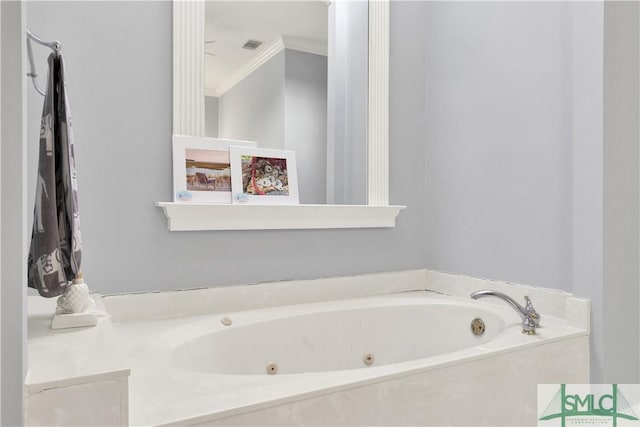 bathroom with a washtub and crown molding