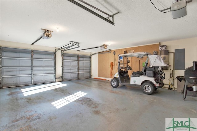 garage featuring electric panel and a garage door opener