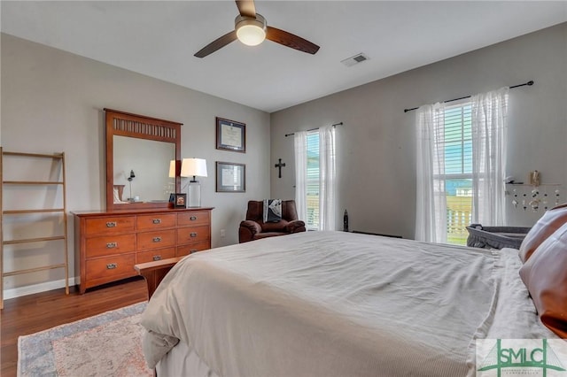 bedroom featuring ceiling fan and dark hardwood / wood-style flooring