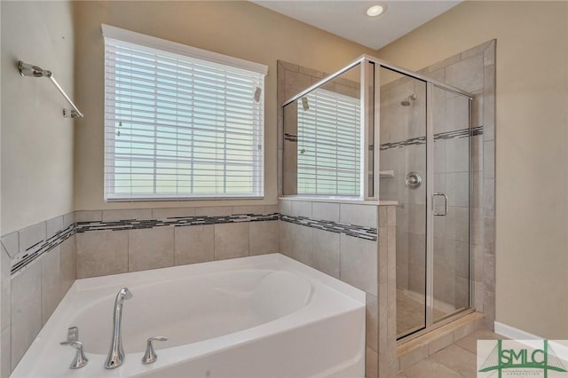 bathroom featuring separate shower and tub and tile patterned floors