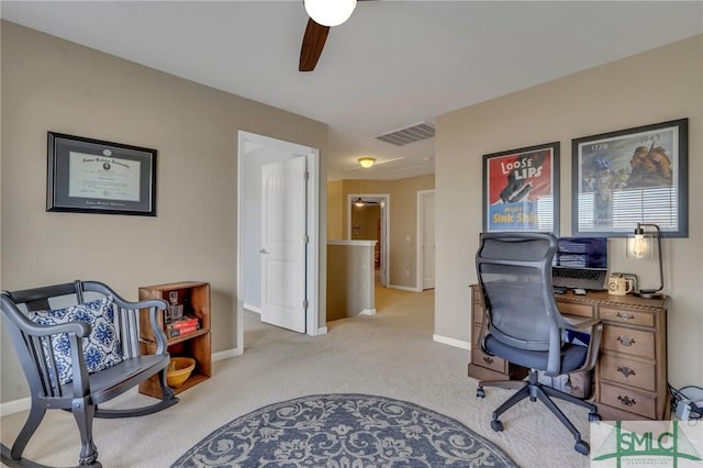 office featuring ceiling fan and light carpet