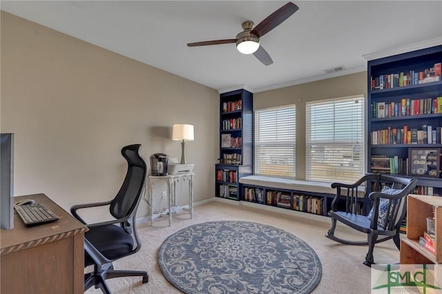 carpeted office space with ceiling fan