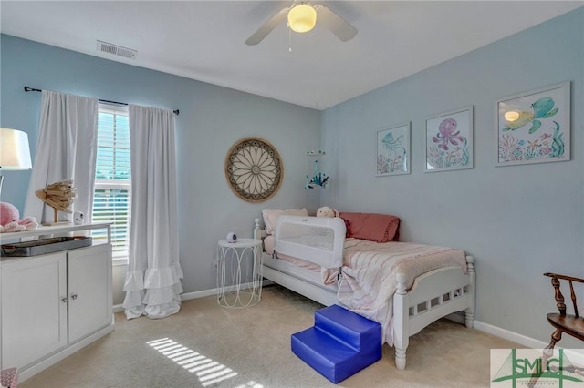 bedroom with ceiling fan and light carpet