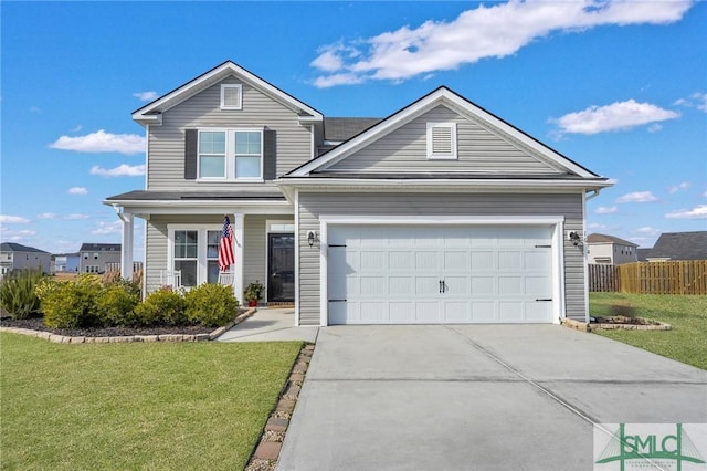 view of front of property with a front yard and a garage