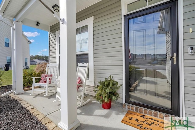 entrance to property featuring a porch