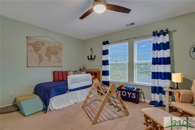 carpeted bedroom featuring ceiling fan