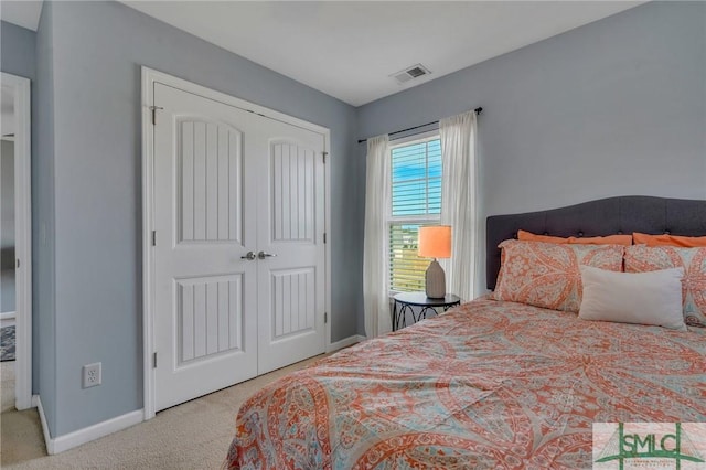 bedroom with a closet and carpet