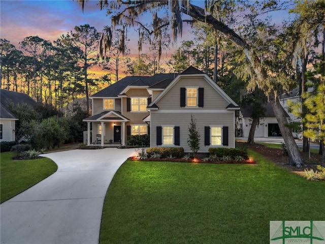 view of front of property with a front lawn and driveway