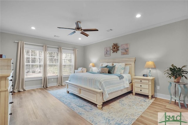 bedroom featuring recessed lighting, baseboards, crown molding, and light wood-style floors