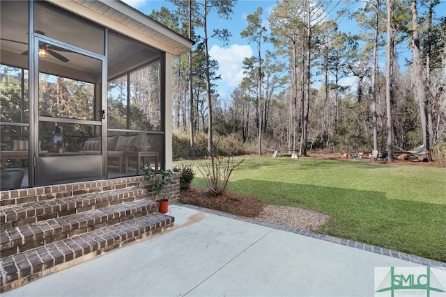 view of patio / terrace featuring a sunroom