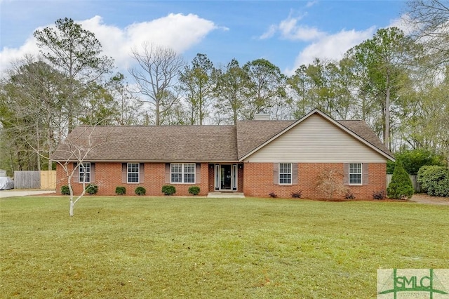 ranch-style home featuring a front yard