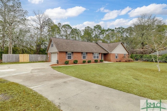 ranch-style house featuring a front yard and a garage