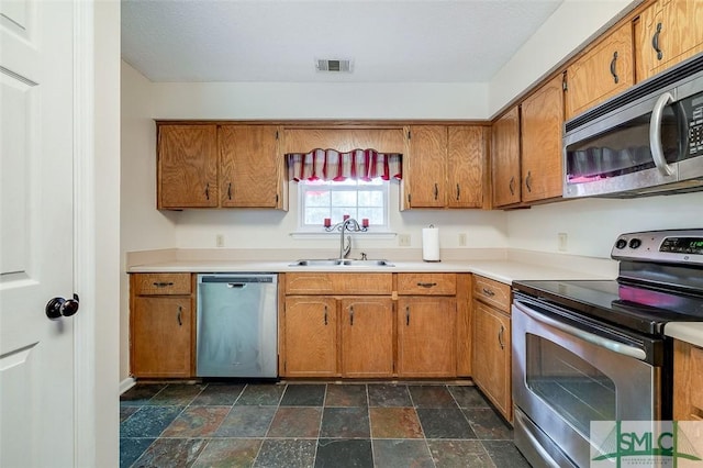 kitchen with appliances with stainless steel finishes and sink