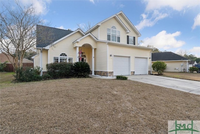 view of front of home with a garage and a front lawn