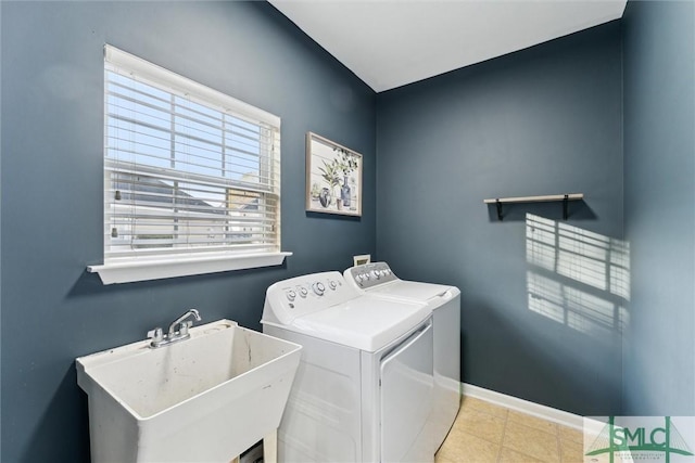 laundry area featuring independent washer and dryer and sink