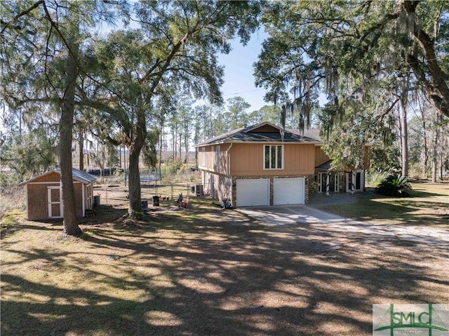 view of property exterior with a garage and a storage shed