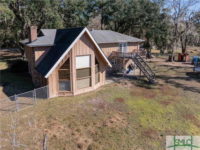 exterior space featuring a deck and a yard