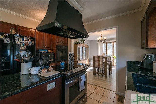 kitchen featuring a textured ceiling, black appliances, sink, island range hood, and light tile patterned floors