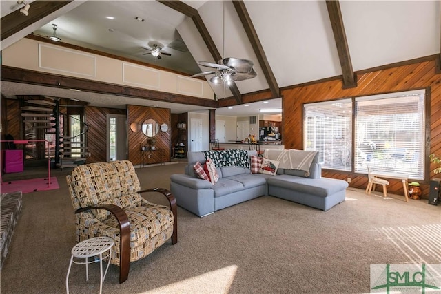 living room featuring carpet flooring, beam ceiling, and high vaulted ceiling