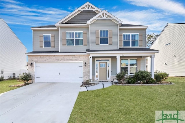 craftsman house featuring a front yard and a garage