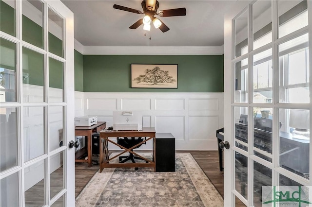 office featuring french doors, crown molding, ceiling fan, and wood-type flooring