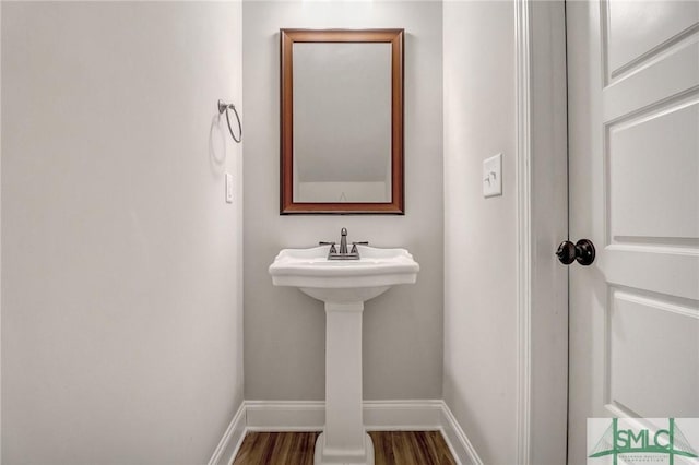 bathroom with wood-type flooring