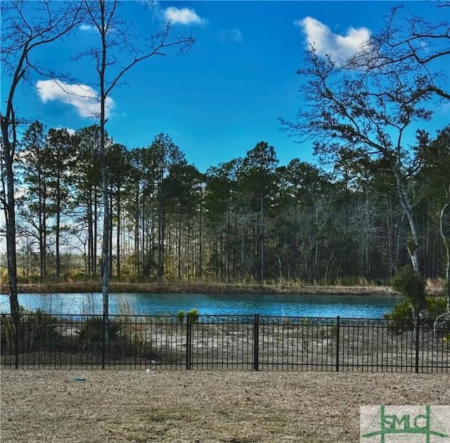 view of swimming pool with a water view