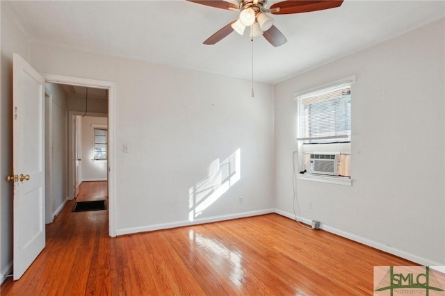 unfurnished room featuring ceiling fan, wood-type flooring, and cooling unit