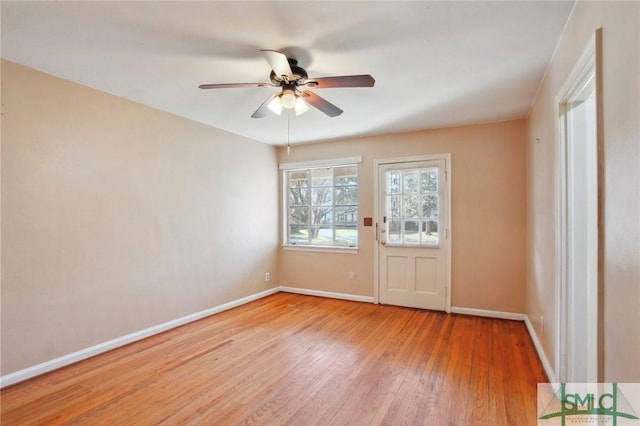 unfurnished room with ceiling fan and hardwood / wood-style flooring