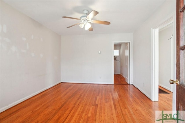 unfurnished room featuring ceiling fan and light hardwood / wood-style flooring