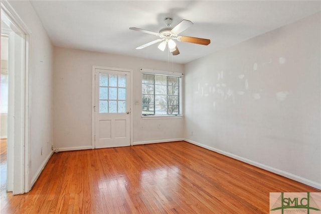 empty room featuring ceiling fan and light hardwood / wood-style floors