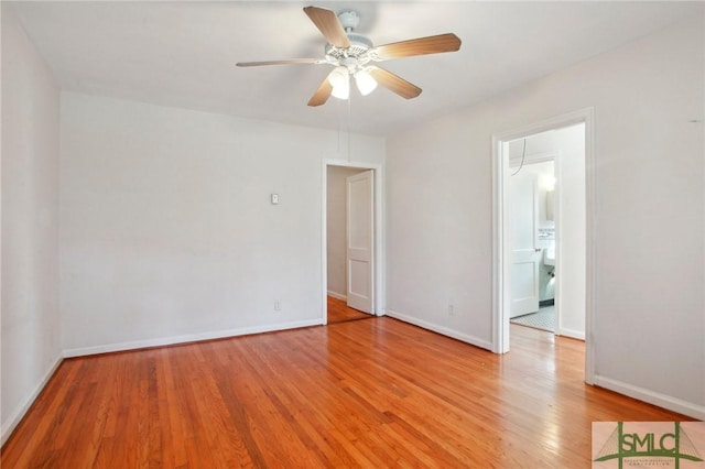 spare room with light wood-type flooring and ceiling fan