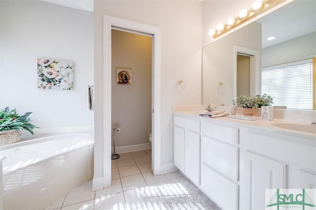 full bathroom featuring tile patterned flooring, toilet, a garden tub, a sink, and double vanity