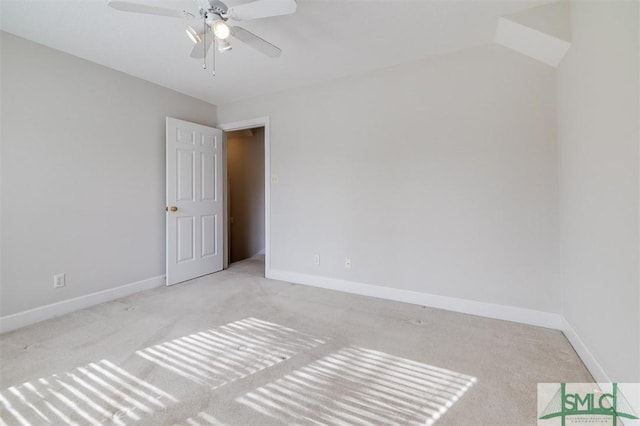 unfurnished room featuring carpet, ceiling fan, and baseboards